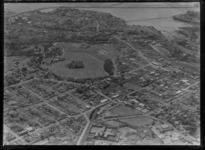 Newmarket Borough, Auckland City, view of Auckland Domain with Auckland Public Hospital, Mount Eden Prison, railway line, Auckland Grammar School, Auckland City Centre and Hobson Bay beyond