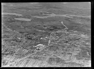 Showing Penrose Southern Motorway under construction, Auckland City area, with Great South Road and railway, intersecting with Pakuranga Highway, residential and commercial buildings, farmland beyond