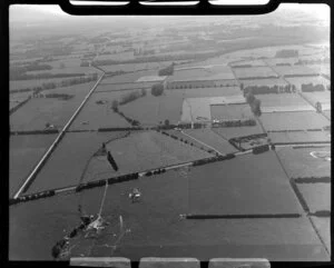 Leamington, Waikato District, view of farmland showing fields with hedgerows, access roads and farm buildings