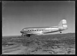 New Zealand National Airways Corporation (NAC) Flagship Dakota aircraft in flight over Auckland