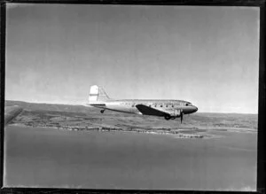 New Zealand National Airways Corporation (NAC) Flagship Dakota aircraft in flight over Auckland