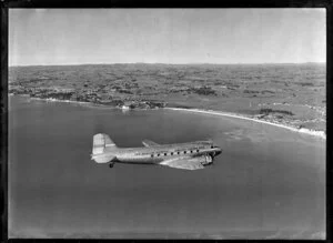 New Zealand National Airways Corporation (NAC) Flagship Dakota aircraft in flight over Auckland