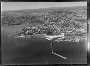 New Zealand National Airways Corporation (NAC) Flagship Dakota aircraft in flight over Auckland