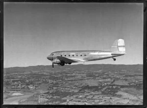 New Zealand National Airways Corporation (NAC) Flagship Dakota aircraft in flight over Auckland