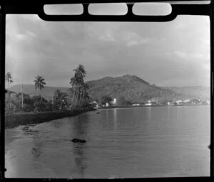 Apia waterfront, Upolu, Samoa, showing beach, palm trees and buildings