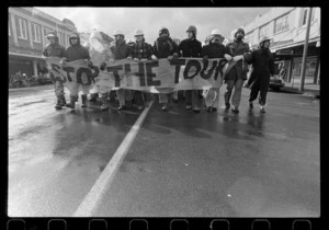 Protesters with "Stop the Tour" banner