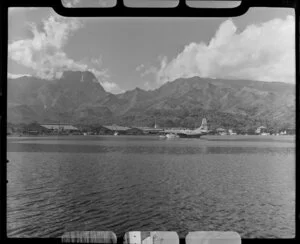 Papeete waterfront, Tahiti, showing Tasman Empire Airways Ltd (TEAL) flying boat in lagoon