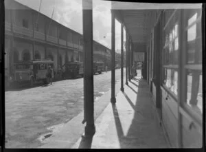 Road scene, Papeete, Tahiti, showing transport buses parked along street