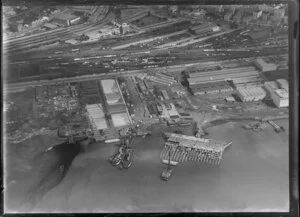 Stacked timber and Car ferry, wharf for exports, Auckland