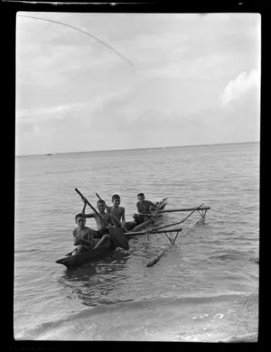 Children in small fishing canoe (Paopao or Va'a alo), Samoa
