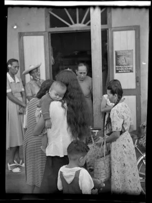 Women and children outside store, Papeete, Tahiti