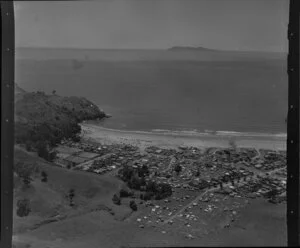 Waihi Beach, Bay of Plenty, showing township, Orokawa Scenic Reserve and Mayor Island in the distance