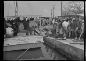 Waterfront scene, people along waterfront and passengers on passenger boat Mitiaro Papeete, Tahiti