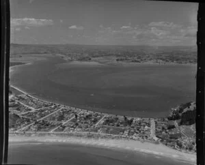 Mount Maunganui, Bay of Plenty, showing Marine Parade and township; Otumoetai in the distance