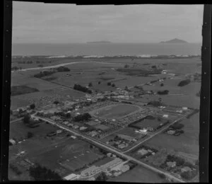 Waipu, Whangarei District, Northland, showing people and cars at racecourse