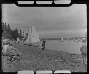 Women and children at the beach at Russell, Bay of Islands, watching a regatta