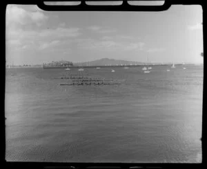Rowing event on Auckland waterfront, showing four teams racing
