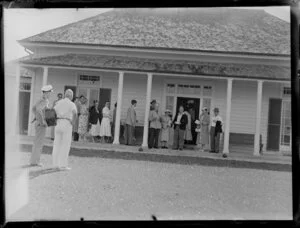 Members of the NAC (New Zealand National Airways Corporation) Bay of Islands scenic flight outside Waitangi Treaty House, Waitangi