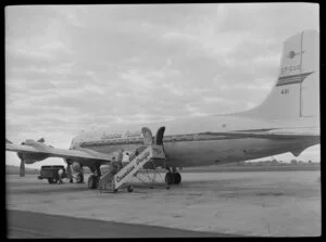 Canadian Pacific Airlines Inaugural DC 6B Service at Whenuapai, showing passengers entering the aircraft