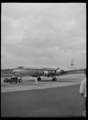 Canadian Pacific Airlines Inaugural DC 6B Service at Whenuapai, showing aircraft leaving airport