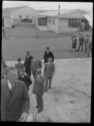 Canadian Pacific Airlines Inaugural DC 6B Service at Whenuapai airport, showing passengers boarding aircraft