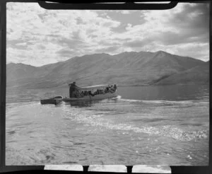 Lake Ohau, Waitaki District, Canterbury Region, showing charter boat with passengers towing a dinghy