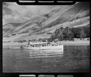 Lake Ohau, Waitaki District, Canterbury Region, showing charter boat with passengers towing a dinghy