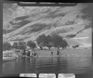 Lake Ohau, Waitaki District, Canterbury Region, showing passengers disembarking from a charter boat with Ohau Lodge in the background