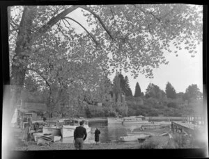 Taupo wharf, showing people and boats