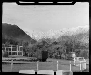 Fox Glacier Hotel grounds and snow covered mountains in distance, West Coast Region
