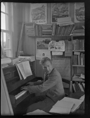 School teacher R Chapman playing the piano at school, Fox Glacier, West Coast Region