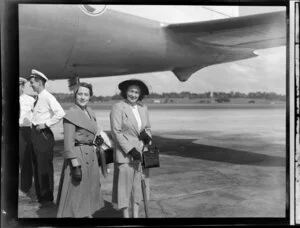 Unidentified women in fashion flight attire at Whenuapai airport