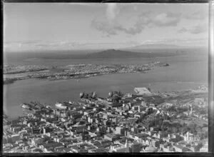 Auckland City and wharves, showing Devonport and Rangitoto Island in the distance