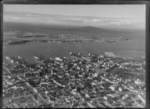 Auckland City and wharves, showing Devonport and Rangitoto Island in the distance