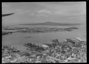 Waterfront scene, including commercial area, looking out towards Devonport and Rangitoto Island, Auckland