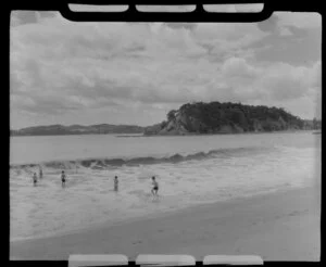 Paihia, Northland, showing bathers and [Motumaire Island?]