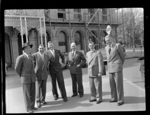 Aviation representatives during the 1953 London-Christchurch Air Race, Christchurch, standing in a street