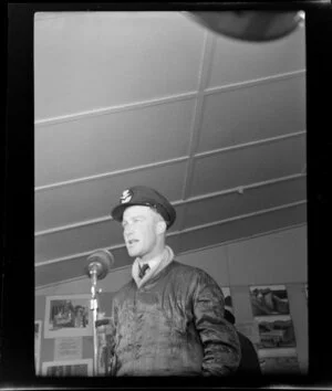 Flight Lieutenant P F Raw, Royal Australian Air Force speaking into a microphone during the 1953 London-Christchurch Air Race, Christchurch