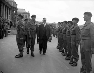 The Prime Minister, Sidney Holland, reviewing SAS Squadron on parade in front of Parliament, October 1955