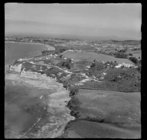 Stanmore Bay, Whangaparaoa Peninsula, Auckland Region, showing houses and cliff face