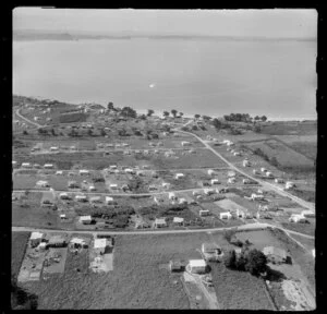 Stanmore Bay, Whangaparaoa Peninsula, Auckland Region, showing houses and looking out to sea
