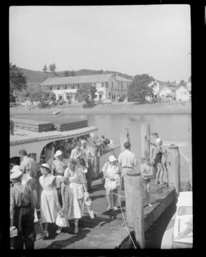 Passengers disembarking off 'cream trip' launch, Russell, Bay of Islands, including the Duke of Marlborough Hotel in the background