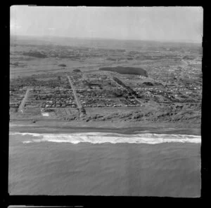 Castlecliff, Wanganui, coastal view with beach and houses, with farmland and city beyond