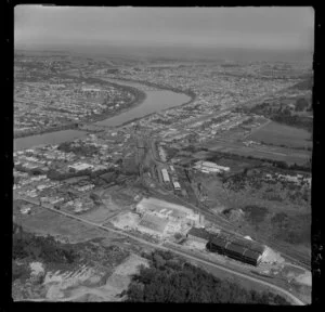 Wanganui, view of Kempthorne Prosser Chemical Works with Brunswick Road and Seddon Street, railyard and rail-bridge, Middle Bridge over the Wanganui River to the city and coast beyond