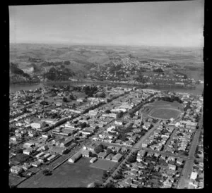 Wanganui, showing Victoria Avenue, Saint Hill Street, rugby grounds and running track next to Cooks Gardens, with the Whanganui River and farmland beyond