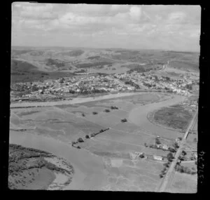 Helensville, Auckland, showing Mill Road (part of State Highway 16) and Kaipara River with oxbow bends running through dairy country