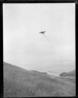 Grumman Avenger aircraft testing superphosphate topdressing, canvas structure catching fertiliser distribution, Masterton