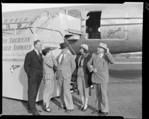 Pan American World Airways, passengers, Mr Harvey Hancock (left), [Mrs?] Sue Hancock, Mr Pascal Cowan (centre), [Mrs?] Frances Kroll and Mr Frederick Kroll, [Auckland?]