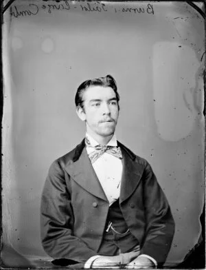 Half length portrait of a man in a suit, probably a tailor named Mr Burns; he wears a neck tie
