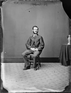 Seated portrait of a man in a suit, probably Mr R Tingey - Photograph taken by Thompson & Daley
